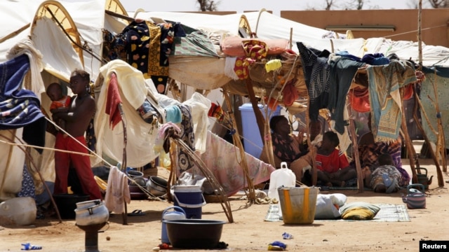 Malians displaced by war gather at a makeshift camp in Sevare, about 600 kms (400 miles) northeast of the capital Bamako, July 11, 2012.