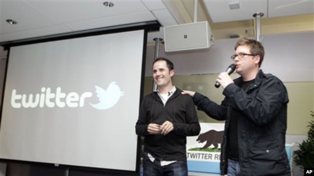 Twitter co-founder Biz Stone, right, talks next to CEO Evan Williams about changes to the social network at Twitter headquarters in San Francisco,   (2010 file photo)