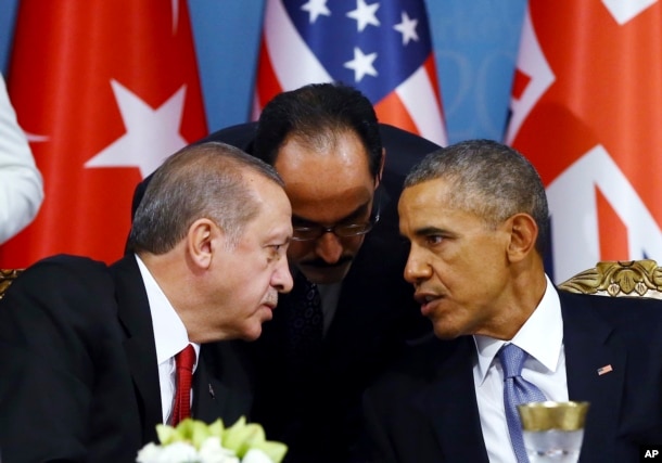 FILE - Turkish President Recep Tayyip Erdogan, left, and U.S. President Barack Obama chat during a session of the G-20 Summit in Antalya, Turkey, Nov. 15, 2015.