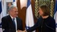 Israel's Prime Minister Benjamin Netanyahu (L) shakes hands with former Foreign Minister Tzipi Livni, head of the centrist Hatenuah party, during their joint statement at the Knesset, the Israeli parliament, in Jerusalem, February 19, 2013.