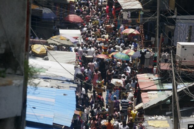 People crowd a street in a market in Lagos, which is expected to overtake Cairo soon as Africa's largest city.