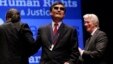 Chinese human rights activist Chen Guangcheng, center, smiles after being awarded the 2012 Tom Lantos Human Rights Prize by actor Richard Gere, right, on Capitol Hill in Washington, Jan 29, 2013.