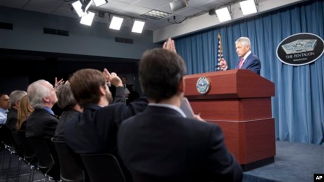 Defense Secretary Chuck Hagel speaks with reporters after announcing the U.S. will add 14 interceptors to a West Coast-based U.S.-based missile defense system, at the Pentagon, March 15, 2013.