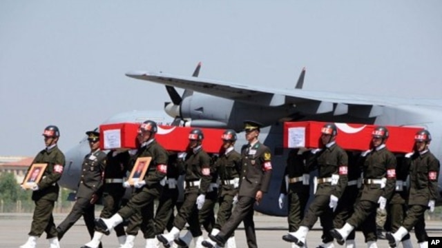 Turkish soldiers carrying the coffins of soldiers who were killed in an attack by members of the Kurdistan Workers' Party (PKK) during funerals in Van, August 18, 2011.