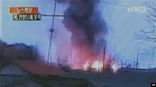In this image take from TV footage, smoke rises from South Korea's Yeonpyeong island near the border against North Korea, 23 Nov 2010