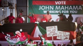 Ghanian President John Dramani Mahama, center left, speaks to supporters at his final campaign rally, in Accra, December 5, 2012.
