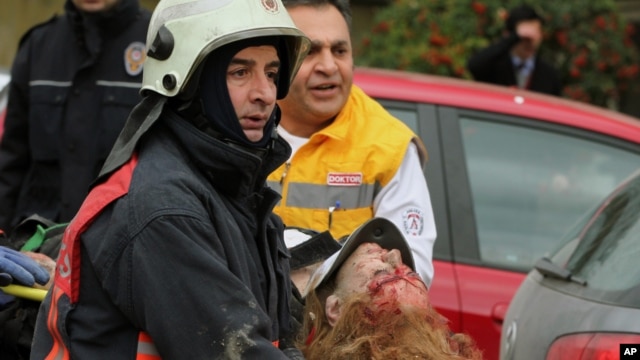 Medics carry an injured woman on a stretcher to an ambulance after a suspected suicide bomber detonated an explosive device at the entrance of the U.S. Embassy in the Turkish capital, Ankara, February 1, 2013. 