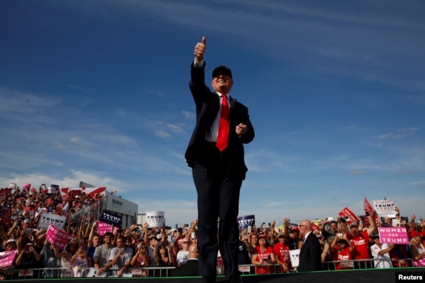 FILE - Republican U.S. presidential nominee Donald Trump rallies with supporters at the Million Air Orlando airplane hangar in Sanford, Florida, Oct. 25, 2016.