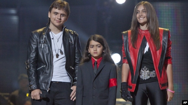 In this Oct. 8, 2011 file photo, from left, Prince Jackson, Prince Michael II "Blanket"Jackson and Paris Jackson arrive on stage at the Michael Forever the Tribute Concert, at the Millennium Stadium in Cardiff, Wales.