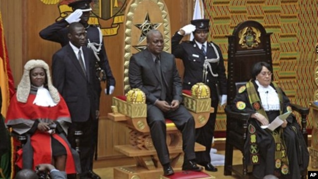 Former Ghanaian Vice President John Mahama is seated after being sworn in as President, July 24, 2012.