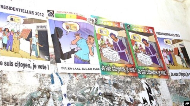 Posters encourage citizens to vote. The second to the left tells people not to accept bribes from political campaigners in exchange for votes, January 23, 2012
