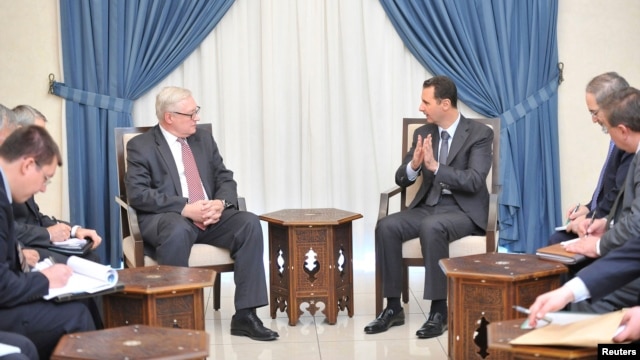 Tổng thống Syria Bashar al-Assad gặp Thứ trưởng Ngoại giao Nga Sergei Ryabkov tại Damascus, ngày 18/9/2013.
