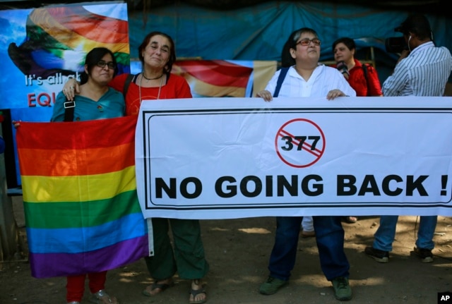 A group of Indian activists hold a banner against section 377 of the Indian Penal Code that criminalizes homosexuality during a protest in Mumbai, India, Dec. 11, 2013.