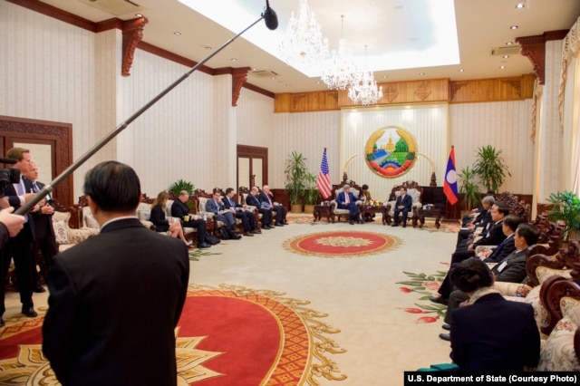 U.S. Secretary of State John Kerry speaks to Laotian Prime Minister Thongsing Thammavong during the outset of a bilateral meeting at the Government House in Vientiane, Laos, Jan. 25, 2016.