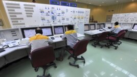 In this photo released by the International Iran Photo Agency, technicians work at the Bushehr nuclear power plant, outside the southern city of Bushehr, August 23, 2010.