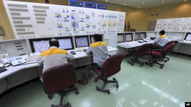 In this photo released by the International Iran Photo Agency, technicians work at the Bushehr nuclear power plant, outside the southern city of Bushehr, August 23, 2010.