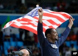 Rio Olympics Basketball Men: United States' Kevin Durant celebrates winning the men's basketball gold medal at the 2016 Summer Olympics in Rio de Janeiro, Brazil, Sunday, Aug. 21, 2016.