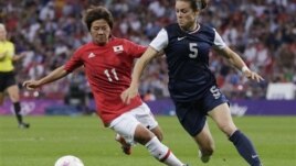 Japan's Shinobu Ohno, left, and US' Kelley O'Hara, vie for ball during women's soccer gold medal match Aug. 9, 2012