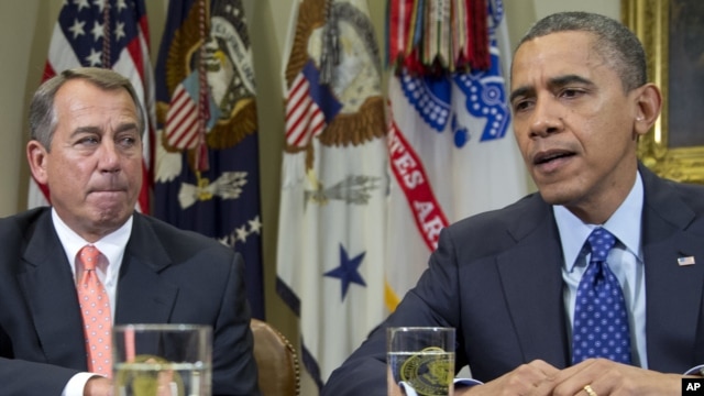 President Barack Obama, accompanied by House Speaker John Boehner of Ohio, speaks to reporters in the Roosevelt Room of the White House in Washington, November 16, 2012.