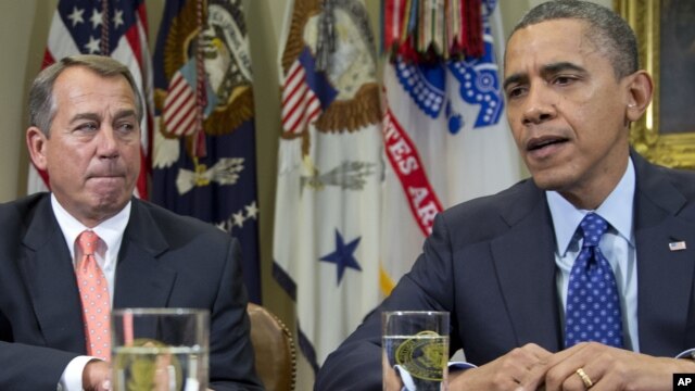 President Barack Obama, accompanied by House Speaker John Boehner of Ohio, speaks to reporters in the Roosevelt Room of the White House in Washington, November 16, 2012.