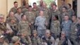 In this image released by the U.S. Department of Defense and taken Monday, Aug. 20, 2012, Army Gen. Martin E. Dempsey, chairman of the Joint Chiefs of Staff, talks to American service members with International Security Assistance Forces in Kabul, Afghani