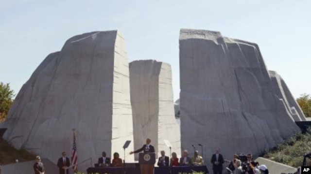 President Barack Obama speaks at the dedication of the Martin Luther King Jr. Memorial in Washington, October 16, 2011.