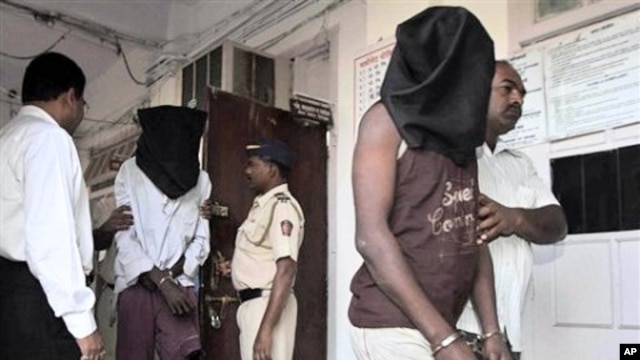 Indian police officials escort alleged pirates at a police station in Mumbai, India (File Photo - January 31, 2011).