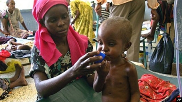 A severely malnourished Somali child receives Oral Rehydration Salts at Mogadishu's Banadir hospital on July 28, 2011