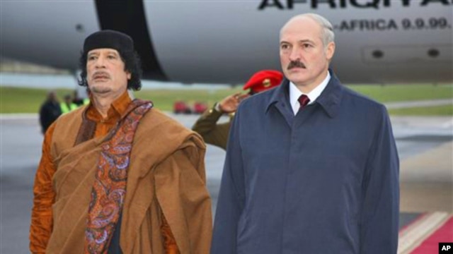 Belarusian President Alexander Lukashenko, right, and Libyan leader Moammar Gadhafi seen during a welcome ceremony in Minsk, Belarus, Saturday, Nov. 2, 2008