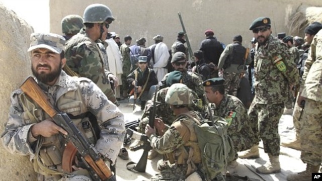 Afghan security forces are seen after Taliban militants opened fire on delegation of senior Afghan officials in Panjwai, Kandahar province in southern Afghanistan, March. 13, 2012. 