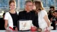 Director Abdellatif Kechiche, center, actors Lea Seydoux, left, and Adele Exarchopoulos pose with the Palme d