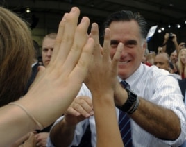 Republican presidential nominee Mitt Romney greets audience members at a campaign rally at the airport in Sanford, Florida, November 5, 2012.