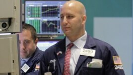 Traders work on the floor of the New York Stock Exchange, September 6, 2012.  