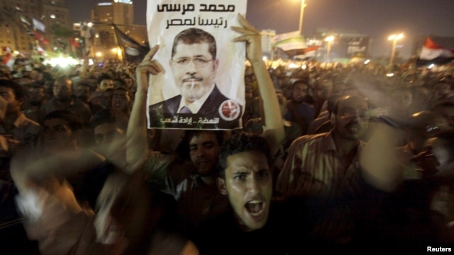 Supporter of President Morsi during celebration of his dismissal of former defense ministers, Tahrir Square, Cairo, Aug. 13, 2012.