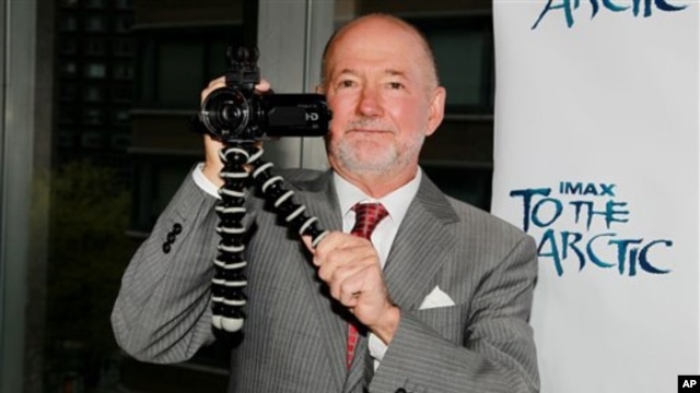 Director Greg MacGillivray holds a camera at a showing of "To the Arctic" held in New York city in April 2012.