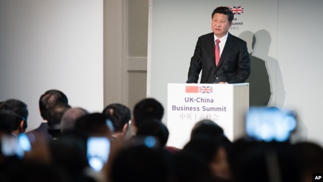 FILE - China's President Xi Jinping addresses participants of the UK-China Business Summit in Mansion House, London, Oct. 21, 2015. Britain will be China's "partner of choice" in the West, Prime Minister David Cameron declared as part of meetings with Xi.