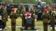 British soldiers from the Light Dragoons lay to rest their fallen colleague, Lance Corporal Nigel Moffett, during a burial service in Belfast (file photo).