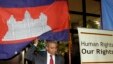U.N. special rapporteur Surya Subedi walks through a Cambodian national flag upon his arrival in a conference room of U.N. headquarter in Phnom Penh, Cambodia in 2010.