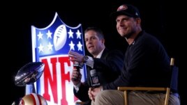 San Francisco 49ers head coach Jim Harbaugh (R) and his brother, Baltimore Ravens head coach John Harbaugh, speak during their joint press conference ahead of the NFL's Super Bowl XLVII in New Orleans, Louisiana, Feb. 1, 2013