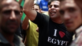Protesters take part in a demonstration at Tahrir Square in Cairo June 15, 2012.