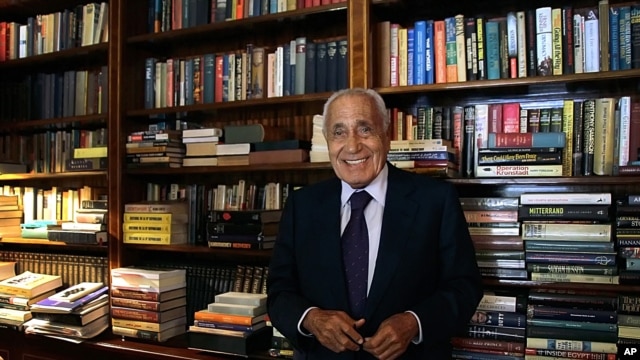 Mohamed Hassanein Heikal, seen in this Sept. 23, 2014 file photo, poses for a picture on his 91st birthday, at his office, in Cairo, Egypt. 