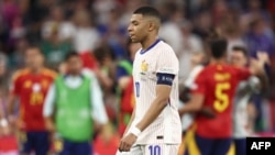 France's forward #10 Kylian Mbappe reacts after losing the UEFA Euro 2024 semi-final football match between Spain and France at the Munich Football Arena in Munich on July 9, 2024. (Photo by FRANCK FIFE / AFP)