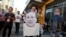 A Los Angeles Clippers fan holds a cut out picture of owner Donald Sterling as the fan arrives to attend the Clippers playoff game five against the Golden State Warriors at the Staples Center in Los Angeles, California, April 29, 2014.