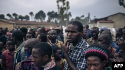 FILE: Hundreds of displaced people who fled the advance of the M23 (March 23 Movement) rebellion wait for a distribution of biscuits at an informal camp in Kanyaruchinya, the northern district of Goma. Taken November 2, 2022