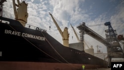 FILE - The first U.N.-chartered vessel MV Brave Commander loads more than 23,000 tons of grain to export to Ethiopia, in Yuzhne, east of Odessa, on the Black Sea coast, on Aug. 14, 2022. Many developing countries rely heavily on Kyiv for grain.