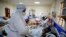 FILE — Medical workers attend to coronavirus patients in the intensive care unit of an isolation and treatment center in Machakos, south of the capital Nairobi, in Kenya, Nov. 3, 2020.