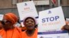 FILE - Activists of South African women's rights groups demonstrate against gender-based violence, outside the magistrate court in Johannesburg, South Africa, Oct. 18, 2022.