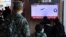 People watch a TV broadcasting a news report on North Korea firing three ballistic missiles into the sea, in Seoul, South Korea, Nov. 2, 2022. (Yonhap via Reuters)