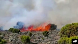 This image made from video shows fires burning on the slopes of Mt. Kilimanjaro in Tanzania, Oct. 23, 2022.