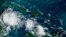 Imaj satelit NOAA montre tanpet twopikal Lisa nan zon Kiba nan lanme Karayib la, 1 Nov. 2022. 